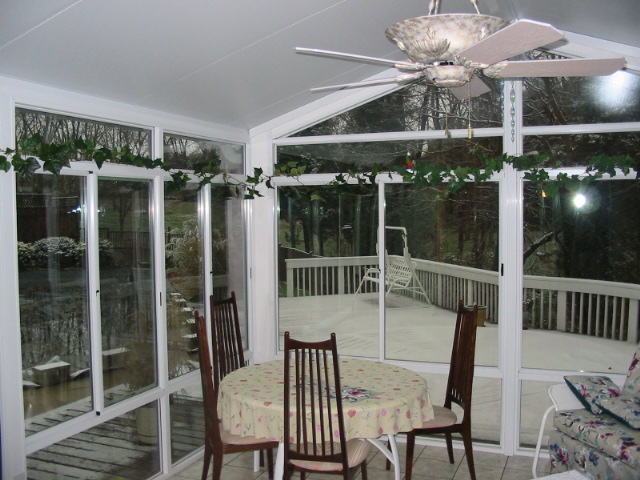 White interior and exterior with glass trapezoids and kickpanels