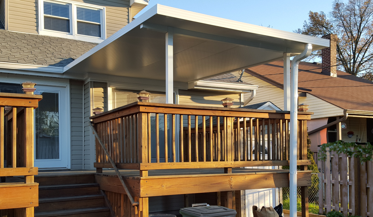 White Solid Roof Patio Cover over wooden deck