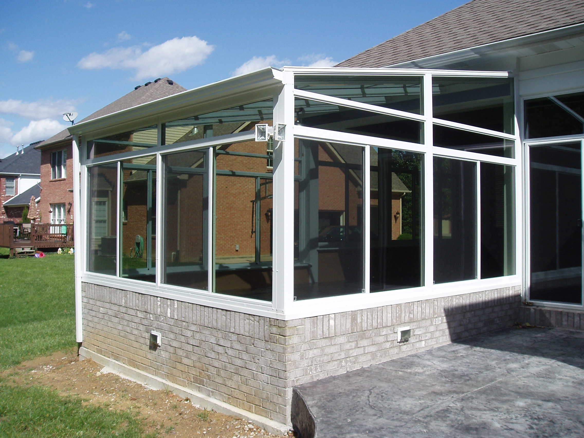 White interior and exterior with glass trapezoids and transoms