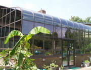 Curved Eave Glass Roof Design Bronze double high on brick basewall